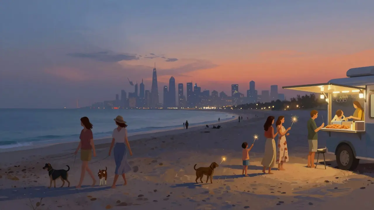 Women and children enjoying a peaceful evening at La Mer Beach with sparklers and food trucks, Dubai skyline in the distance.
